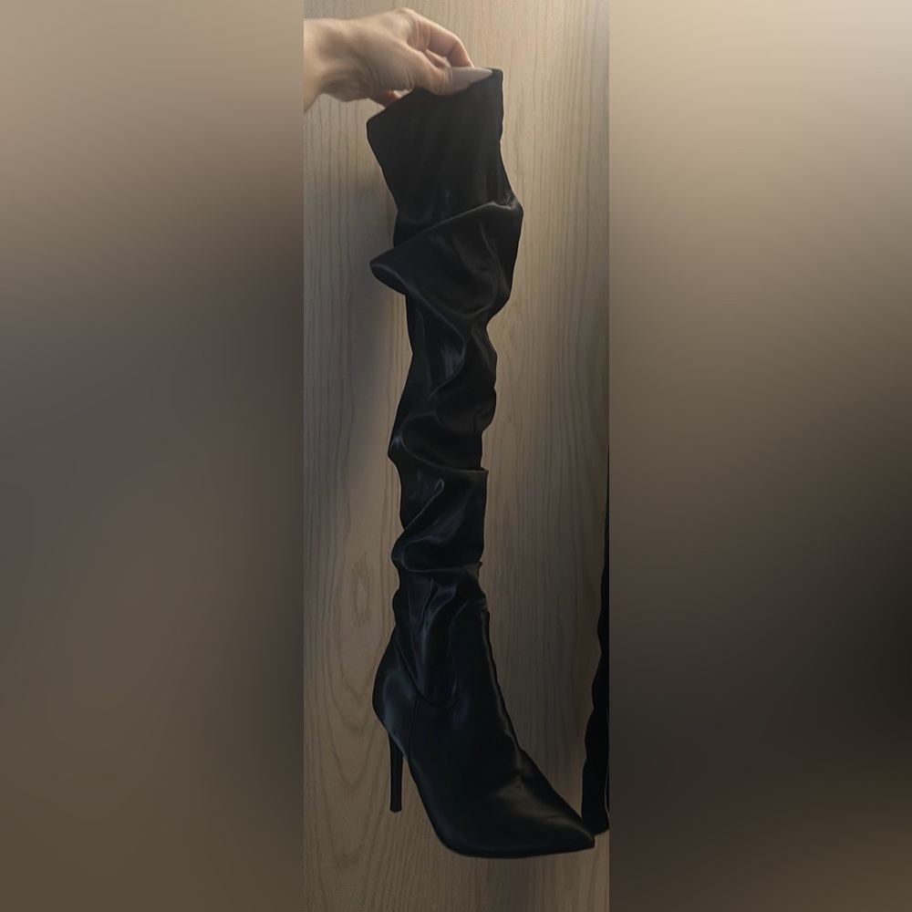 Size 6 thigh high boot. Satiny type material flattering scrunch style. 3.5inches